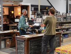 A man checking out at a Lenco Store - Affordable, quality building materials in Buffalo, NY